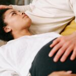 Expectant couple sharing a tender moment with focus on pregnancy and emotional connection.